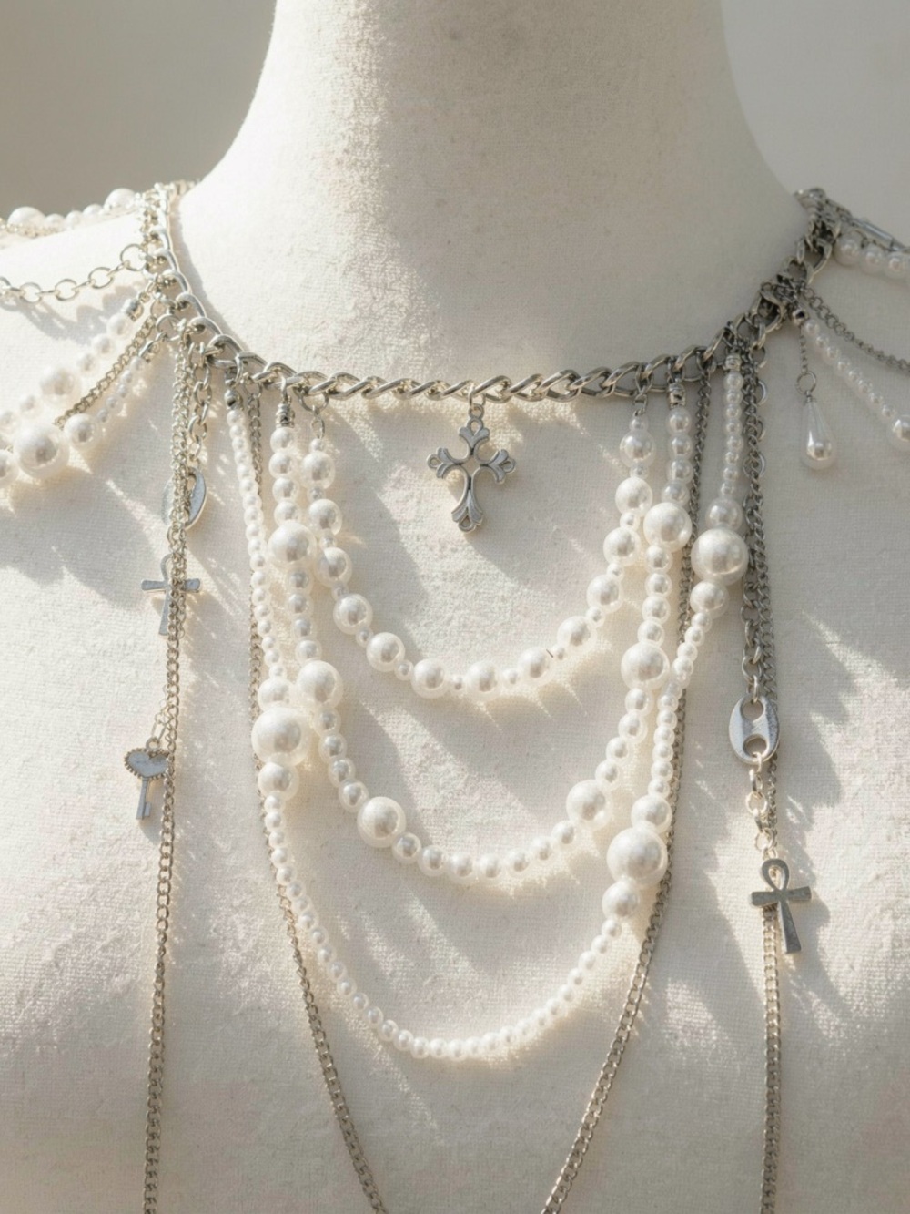 Y2K 2000s style faux pearl necklace with cross and heart charms